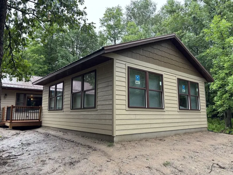 New room addition with lap siding and large windows