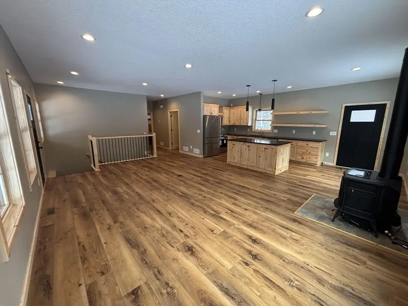 Single-level home with covered porch by Tri-County Professional Builders