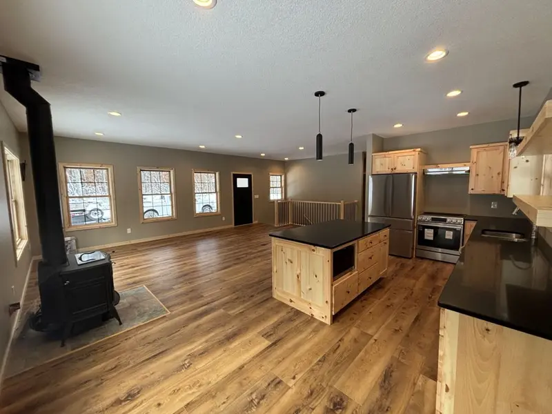 Single-level home with covered porch by Tri-County Professional Builders